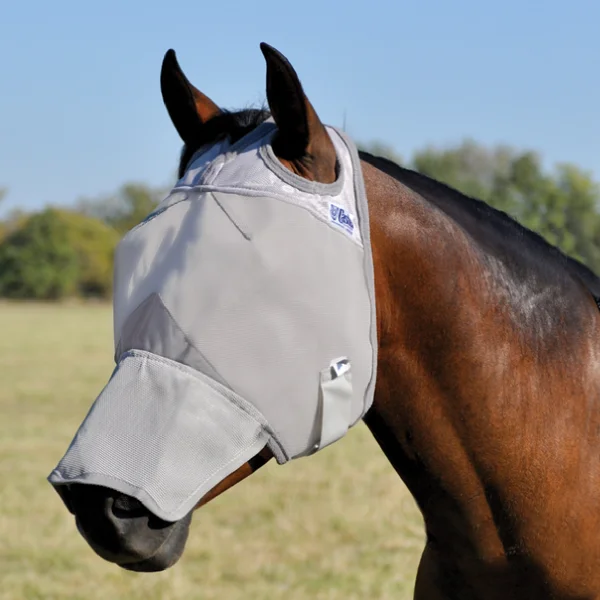 A horse wearing a Cashel Long Nose UV Horse Fly Mask in a field.