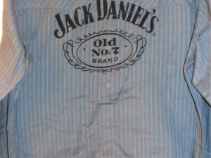 A Jack Daniel's "Old No.7" Grey striped western shirt with the Jack Daniel's logo on it.