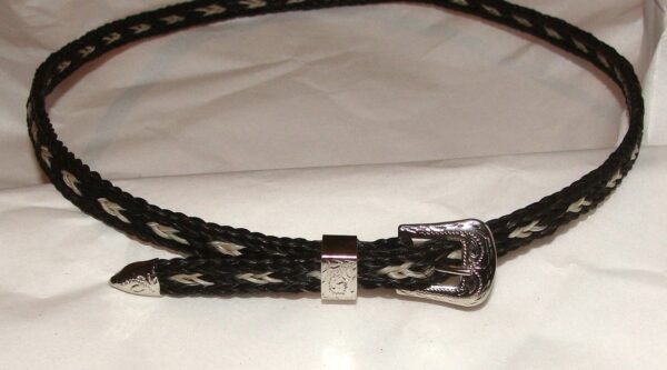 A black and white braided belt with a Sterling Silver Buckle Black Horse hair hat band.