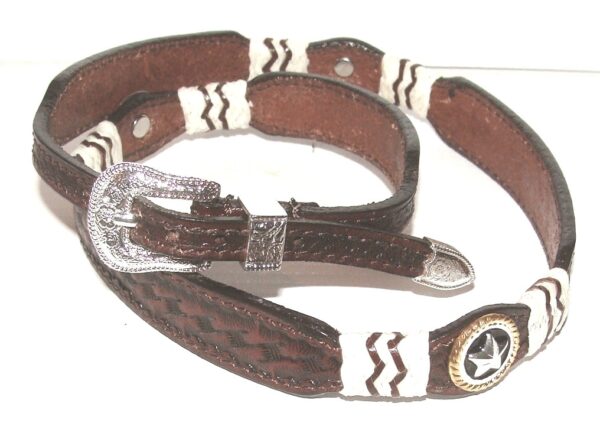 A brown and white cowboy belt with a star on it.