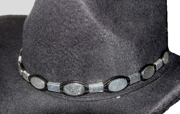 <div class="qsc-html-content"> Black leather hat band with  silver surrounding * S/S conchos <strong>* Silver buckle </strong> * Size: 1/4" to 5/8" wide. * Fits up to 25" <span style="color: blue;">MADE IN THE U.S.A</span> </div> <strong>Condition:</strong> New •