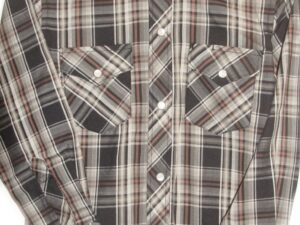 A black and brown plaid shirt on a white background.