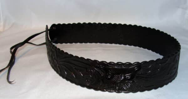 A 1.5" Tooled leather Black Cowboy Hat Band with a floral pattern.
