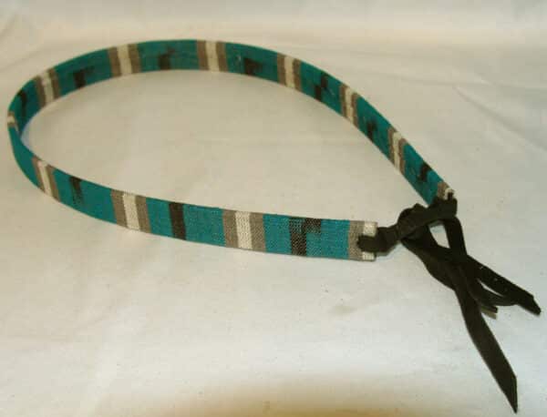 A 3/4" Tapestry Teal Southwestern Cowboy Hat Band with a turquoise and black belt.
