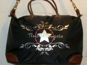 The White Cowgirl bag with silver design