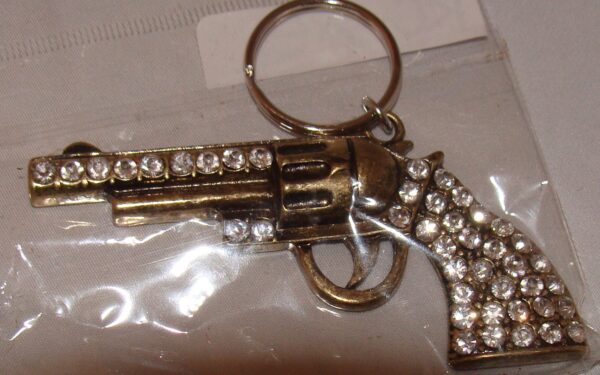 A Gold Rhinestone Gun Pistol Keychain, Western Keyring with crystals on it.