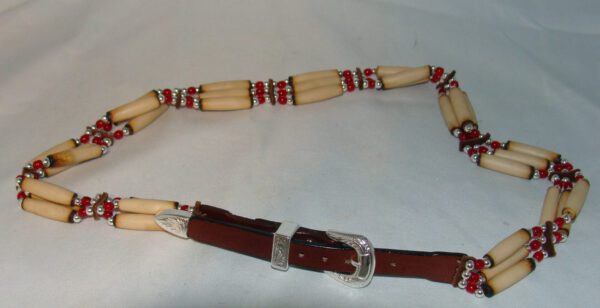 A Cow Bone and Brown Leather Silver Buckle Cowboy Hat Band with red and white beads.