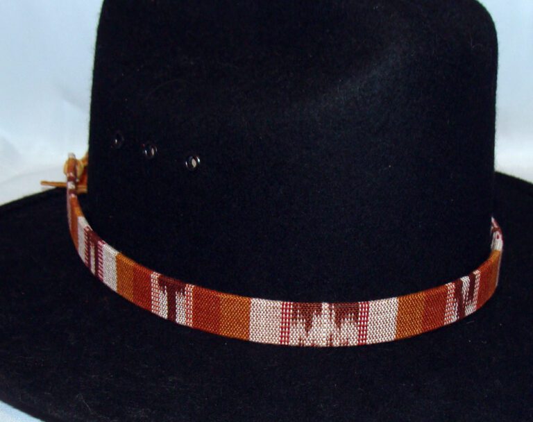 A black hat with a Tapestry Brown Southwestern Cowboy Hat Band.