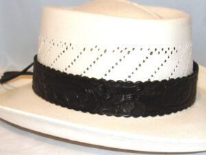 A light colored hat with a black leather band