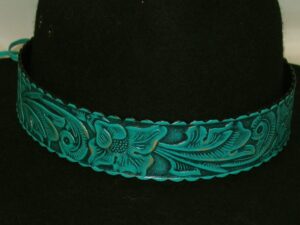 A black hat with a blue leather engraved band