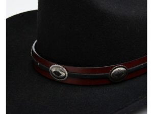 A black hat with a brown band with a metal design