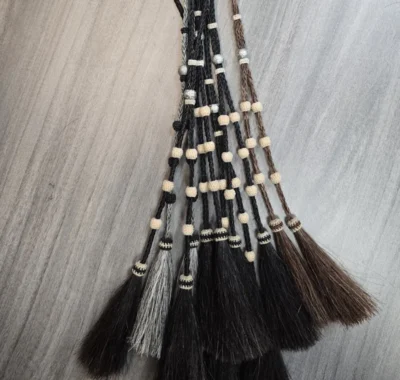 horse hair bolo string ties with hitch knot silver balls and tassels