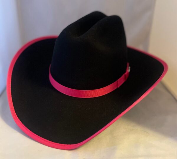 A USA made 'Brittany' Kids Bailey Hot Pink Trim Wool Cowgirl Hat with a pink ribbon.