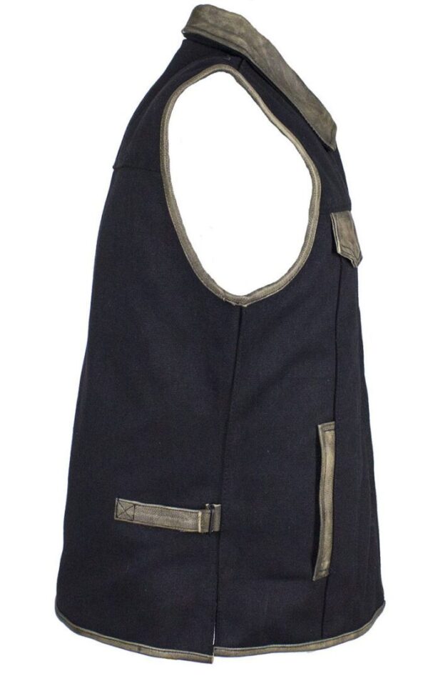 A Mens Black Canvas Zip Up CCW Vest with Distressed Leather Trim with tan zippers and pockets.