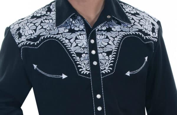 A man wearing a "Gunfighter" Mens White Embroidered Black Western Shirt.