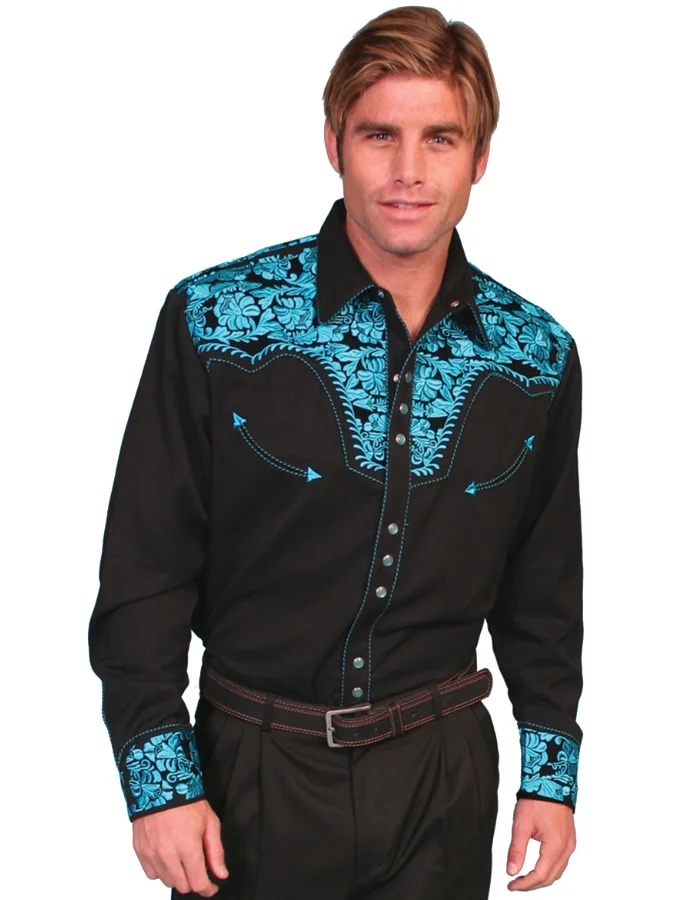 A man wearing a "Turquoise Gunfighter" Mens Turquoise Embroidered Western Shirt.