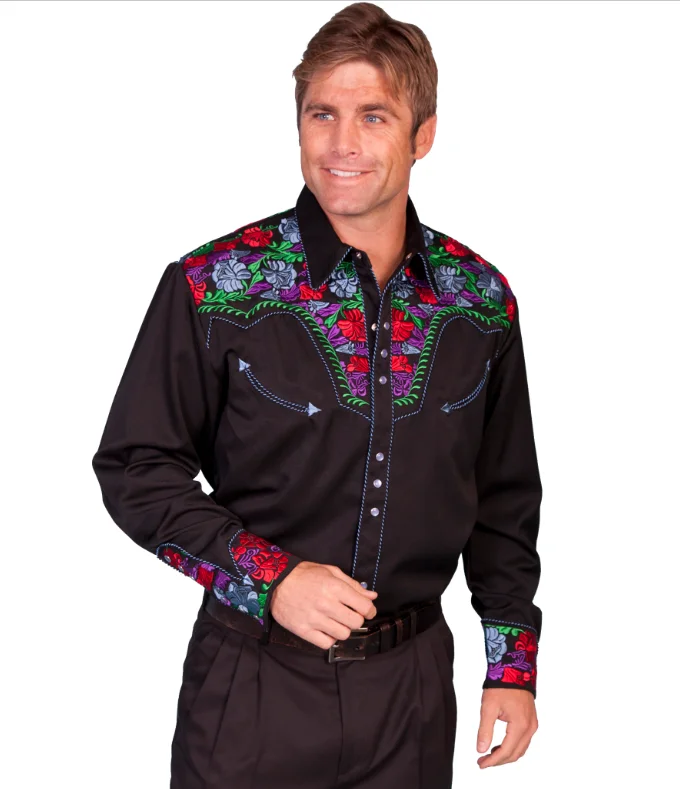 A man wearing a "Screaming Gunfighter" Mens western piped shirt by Scully with colorful floral designs.