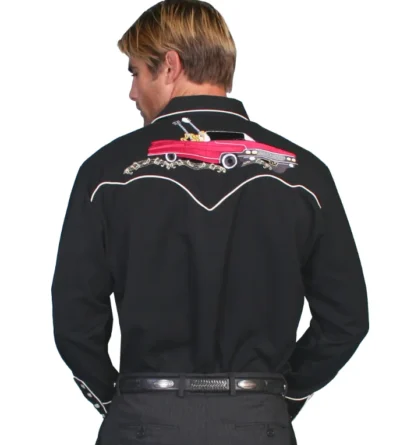 A man wearing a Scully "Rockabilly" Mens Pearl Snap Embroidered Western Shirt with embroidered car design on it.