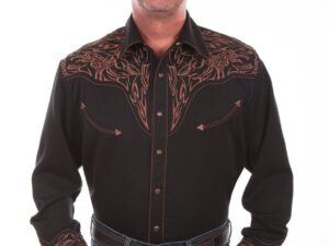 A man wearing a "TRI-BULL" Men's Scully Brown Embroidered Cowboy Shirt and jeans.