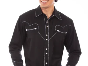 A man wearing a Mens Scully Rockabilly White piped black Western Shirt and jeans.