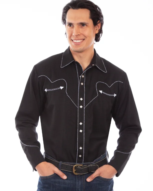 A man wearing a Mens Scully Rockabilly White piped black Western Shirt and jeans.