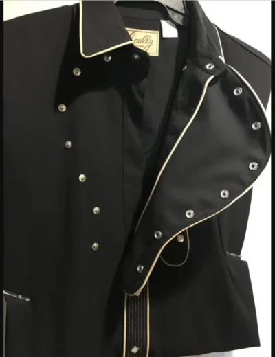 A black jacket with gold studding on it, perfect for men who love a touch of western flair like the Mens Scully Black Bib Embroidered Guitar Shirt.