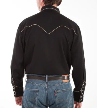 The back view of a man wearing jeans and a Mens Scully Black Bib Embroidered Guitar Shirt.