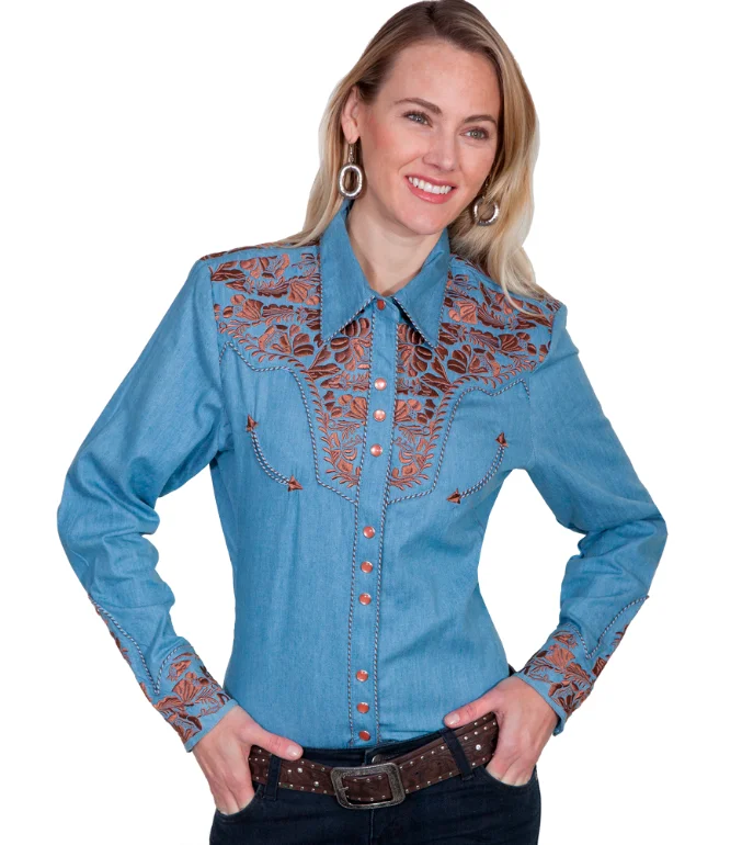 A woman wearing a Scully Womens Blue Denim Embroidered Western Shirt and cowboy hat.