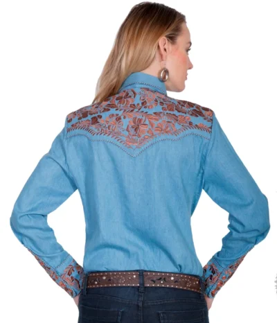 The back view of a woman wearing a Scully Womens Blue Denim Embroidered Western Shirt.