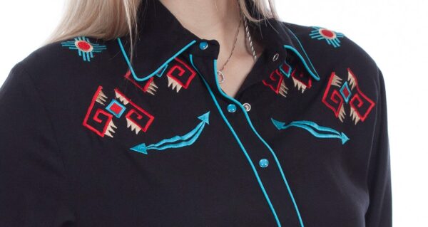 A woman wearing a Womens Scully Turquoise Cactus Retro Black Western Shirt with embroidered designs.