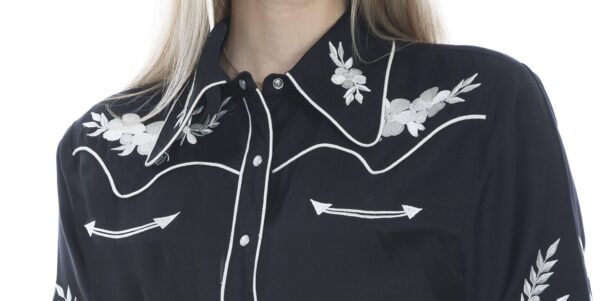 The model is wearing a Women's Scully White Periwinkle Black Western Shirt with floral embroidery.