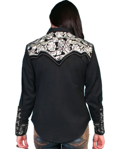 The back view of a woman wearing the Silver Lady Gunfighter Scully Women's Black western shirt, with a touch of silver detail.