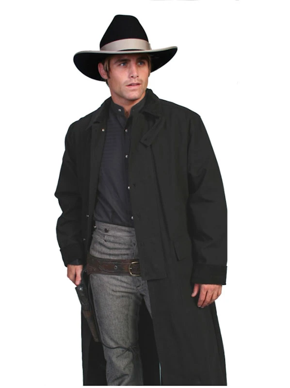 A man wearing a Scully Black Canvas Authentic Frontier Cowboy Duster 3/4 Length.