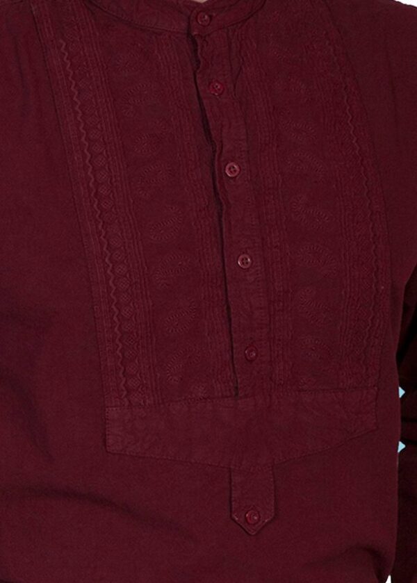A man is wearing a Men's Scully Burgundy Paisley Insert Bib banded collar shirt.