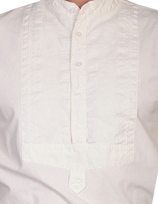A man is wearing a Mens Scully Ivory Paisley Insert Bib banded collar shirt.