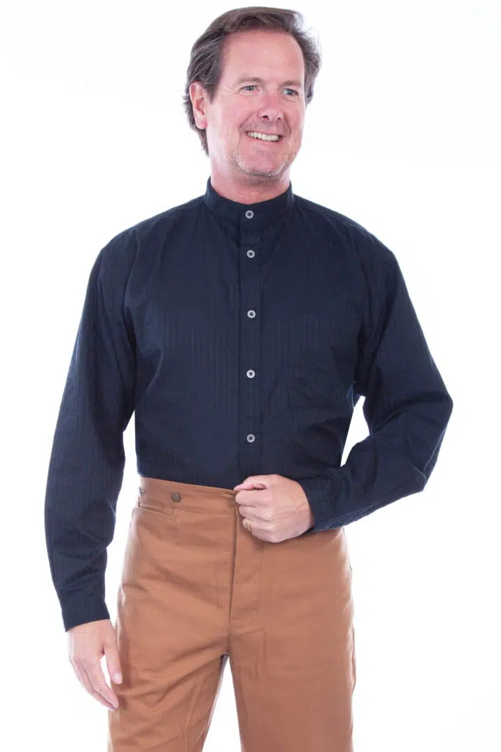 A man in a Mens Scully Black Tonal Chest Pocket Banded Collar Shirt and tan pants.