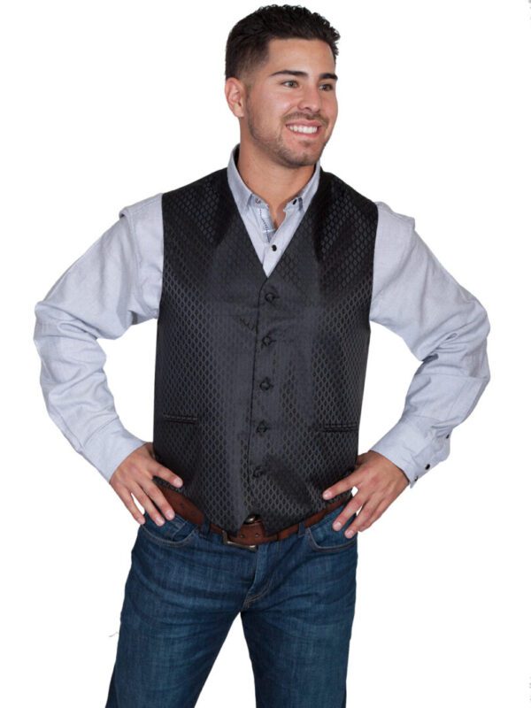 A man wearing a Scully Mens Black Diamond Polyester Western Dress Vest and jeans.