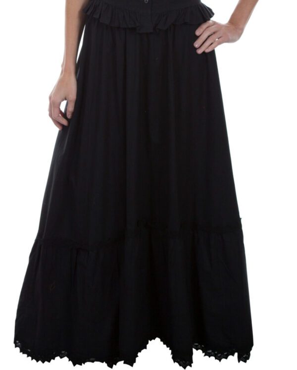 A woman wearing the Scully Womens Prairie Black Cotton Petticoat Skirt with ruffles.