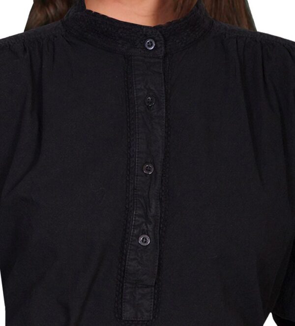 A woman is wearing a Womens Scully 1800s Banded Collar Black Pullover Blouse.