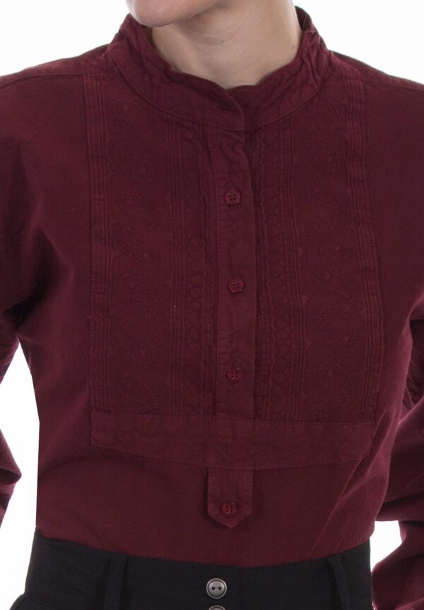 A woman wearing a Womens Scully Paisley Bib front Burgundy blouse.