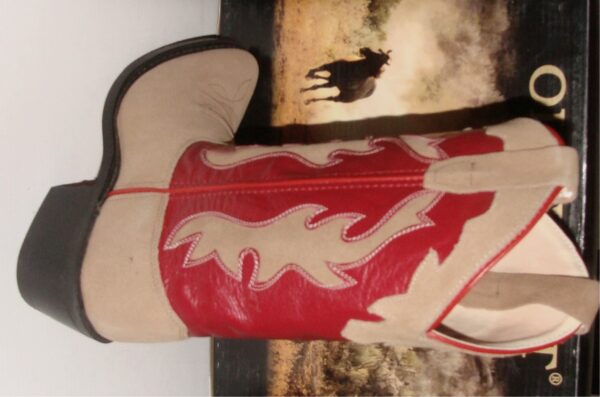 A pair of Youth SIZE 4.5 Red shaft, Roughout leather cowboy boots with a red and white design.