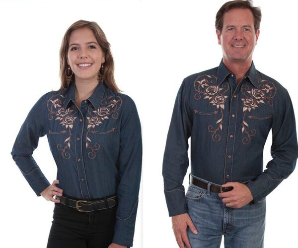 A man and woman standing next to each other in a Scully Women's Rose Embroidered Denim Western Shirt.