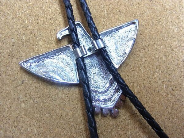A Silver Western Phoenix Bolo Tie on a leather cord.