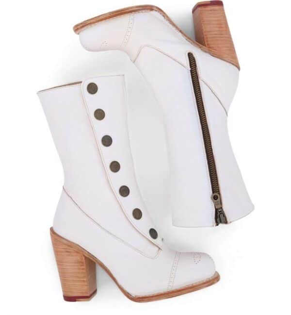 A pair of Amelia Off White Leather Button Snap Womens Zip Granny Boots with wooden heels.