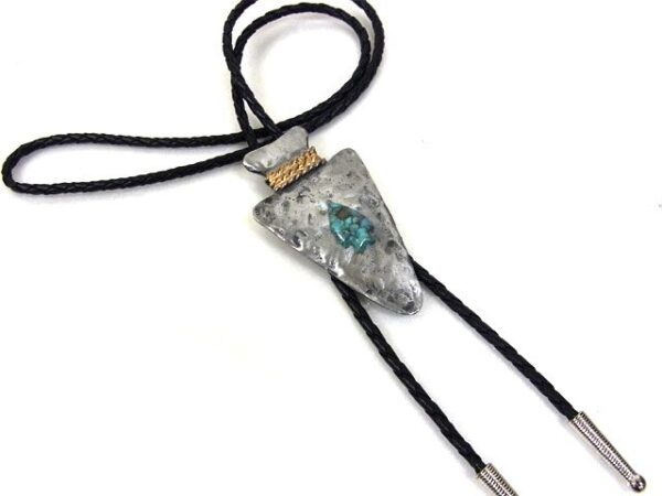 A Hammered Silver Arrowhead Turquoise Stone Bolo Tie with a turquoise stone on it.