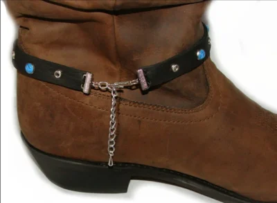 <div class="qsc-html-content"> Black Leather Cowboy boot bracelet <ul style="list-style: square inside none;"> <li>rhinestone and turquoise studded</li> <li>Sold as 1 each</li> <li>adjustable chain</li> <li>USA MADE</li> </ul> </div> •