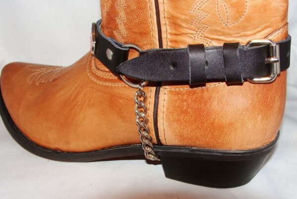 A Shotgun Shell Concho Leather Cowboy Boot Chains with a chain on it.