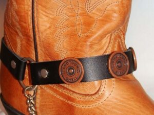 A pair of Shotgun Shell Concho Leather Cowboy Boot Chains with buttons.