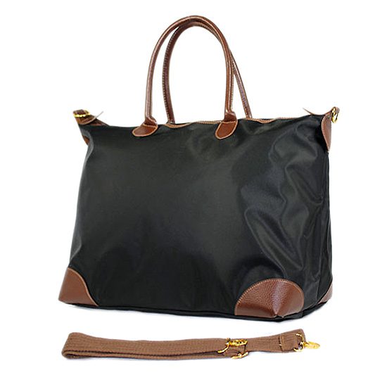 The Wild Cowgirl" Cross-body Black Handbag with a strap.