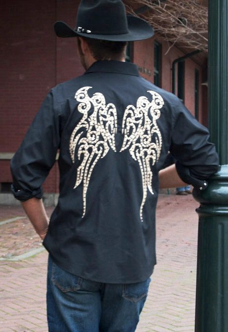 A man in a cowboy hat wearing a Mens Embroidered Wings Black Western shirt.